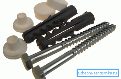 En la foto - accesorios de fijación para la instalación de un inodoro. En la foto - accesorios de fijación para la instalación de un inodoro.