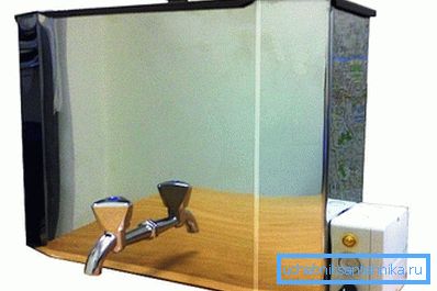 En la foto - un lavabo de pared de acero con calefacción eléctrica. En la foto - un lavabo de pared de acero con calefacción eléctrica.